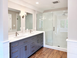 large master bathroom with a double sink and a glass enclosed shower