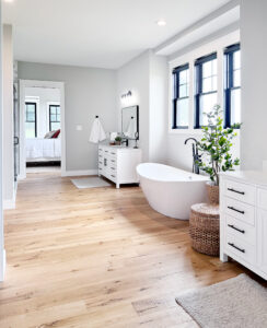 large master bathroom with separate sinks and large tub
